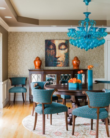 A formal dining room featuring a blue chandelier.