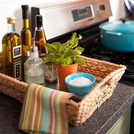 A wicker basket filled with olives and spices, showcasing 6 ways to use baskets in your home.