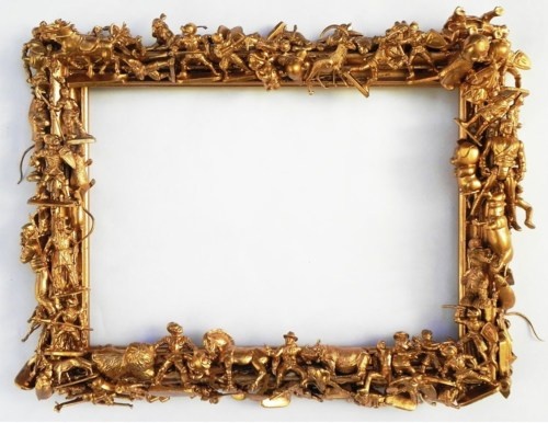 A gold frame adorned with ornaments.