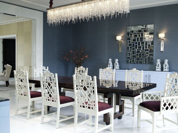 A white table and chairs bring elegance to the formal dining room.