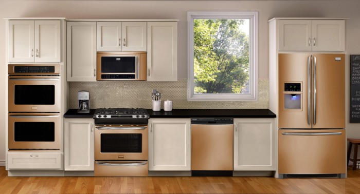 Update your kitchen with stainless steel appliances and white cabinets.