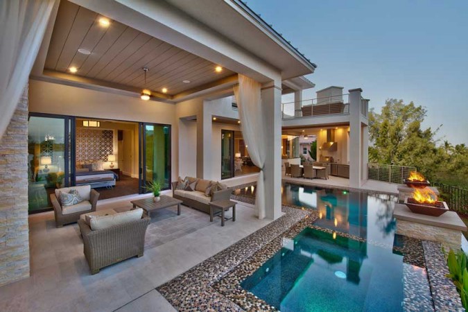 An outdoor living area with luxury patio furniture.