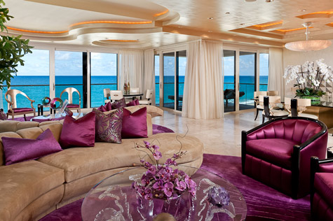 A living room with bold and beautiful purple furniture.