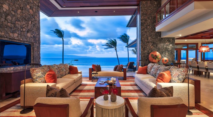 A luxurious living room with a breathtaking view of the ocean.