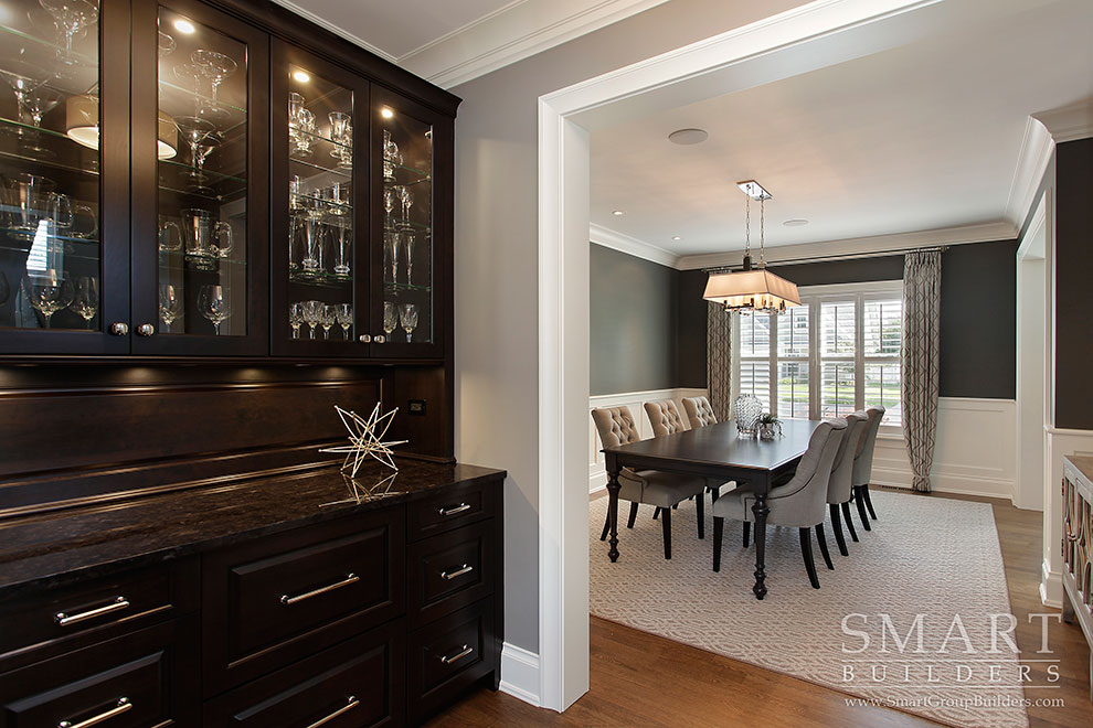 Two resale value boosting solutions for unused spaces, including a black hutch in a dining room.