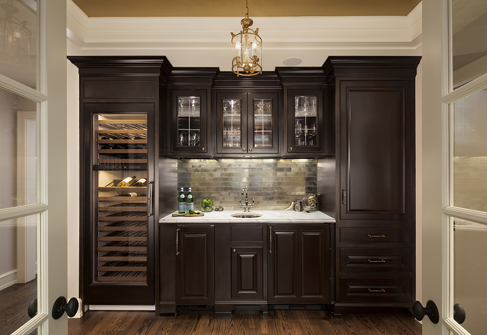 A wine cellar in a home with dark wood cabinets that boosts resale value.