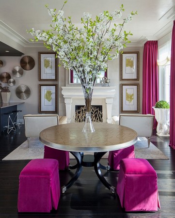A dining room with light and fresh interiors featuring a pink table and chairs, perfect for spring inspiration.
