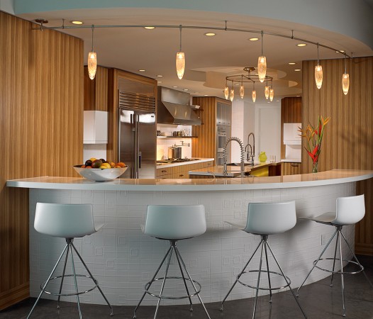 A stylish kitchen bar with sleek stools