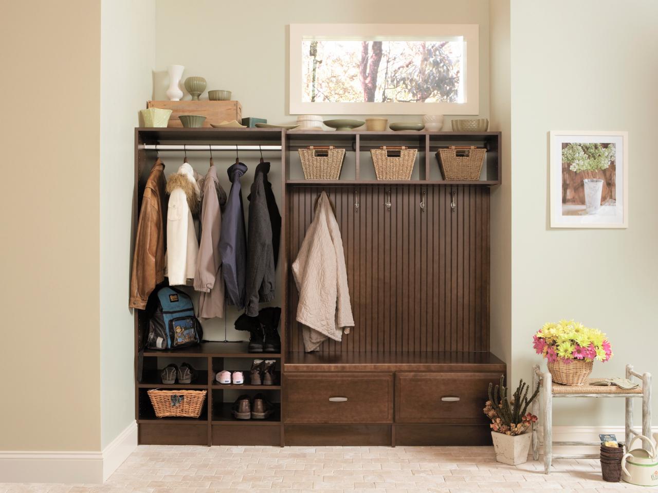 Two resale value boosting solutions for transforming an unused wooden mudroom into a functional space with coat racks and drawers.