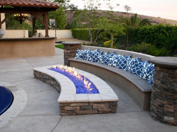 A backyard patio with a fire pit.