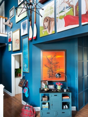 Wow visitors with a stunning foyer featuring lots of art on the walls.