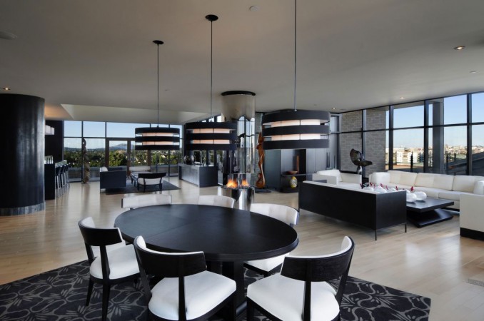 20 Rooms That Make You Say Ahhh... A black and white dining room with a view of the city.