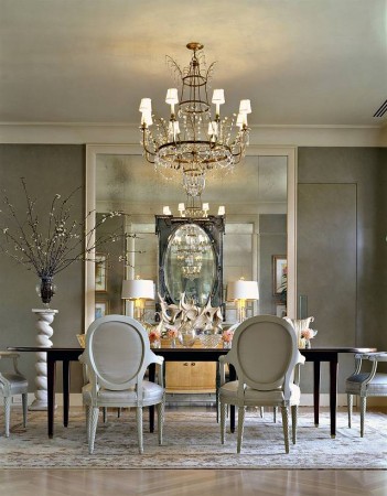 A fashionable dining room with a chandelier.