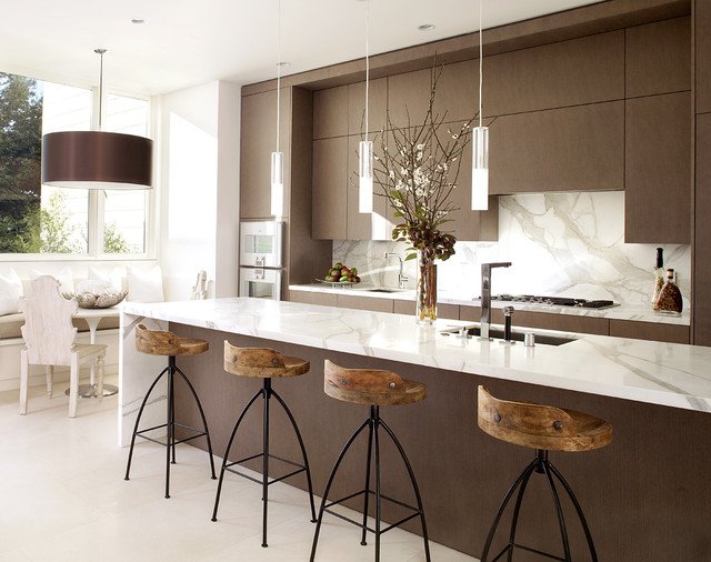 A modern kitchen with brown cabinets and 18 stylish bar stools.