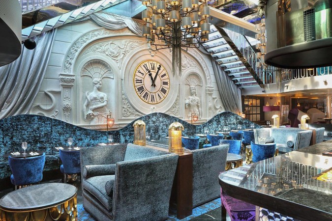 A restaurant with a clock on the wall that inspires home design.