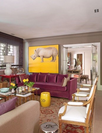 How dining out can inspire your home design using purple couches and a painting of a rhino.