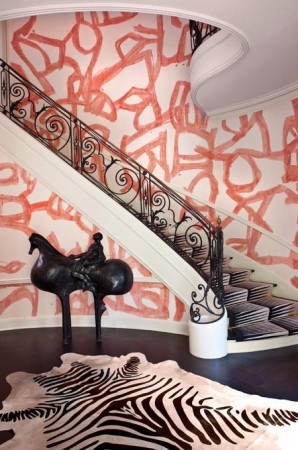 Unique walls and sculpture make this foyer stand out 