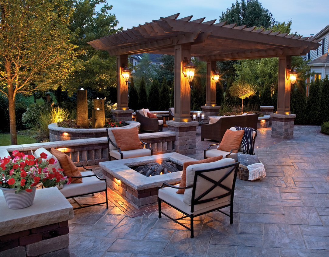 A backyard featuring a fire pit seating area.