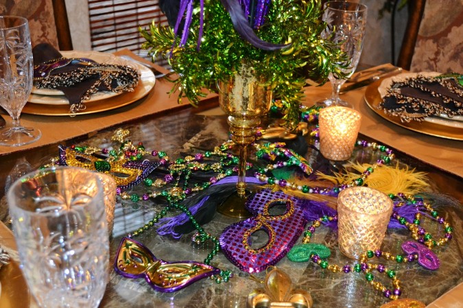 Mardi gras table setting with masks, tribute to New Orleans.