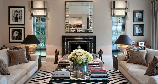 A stylish living room with zebra rugs and a fireplace for the fashionista.