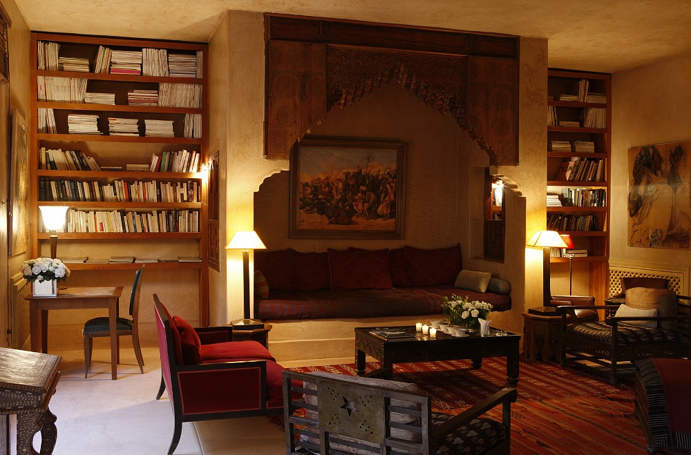 A fireplace and bookshelves in a living room showcasing interior design.