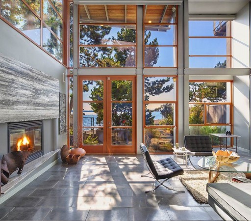 A living room with large windows and a fireplace that will make you say Ahhh...