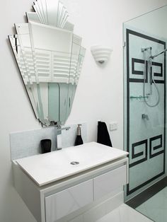 A bathroom with a white sink and mirror, adding visual interest.