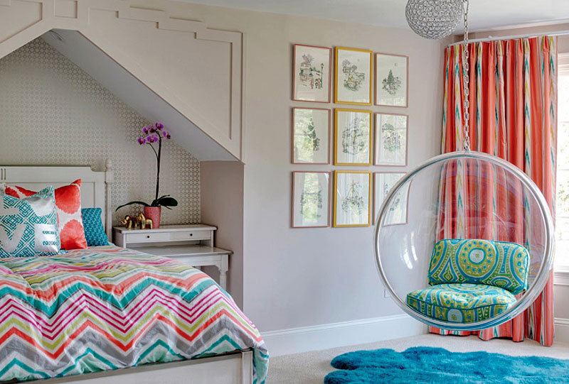 A stylish teenage bedroom with a vibrant bed and cozy hanging chair.