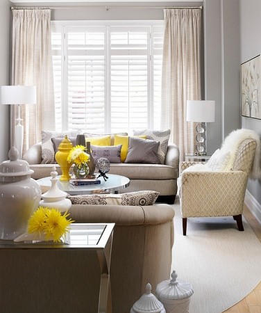 A spring-inspired living room with yellow accents and grey furniture.