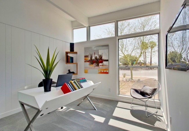 A Mid-Century Modern home office with a white desk and chair.