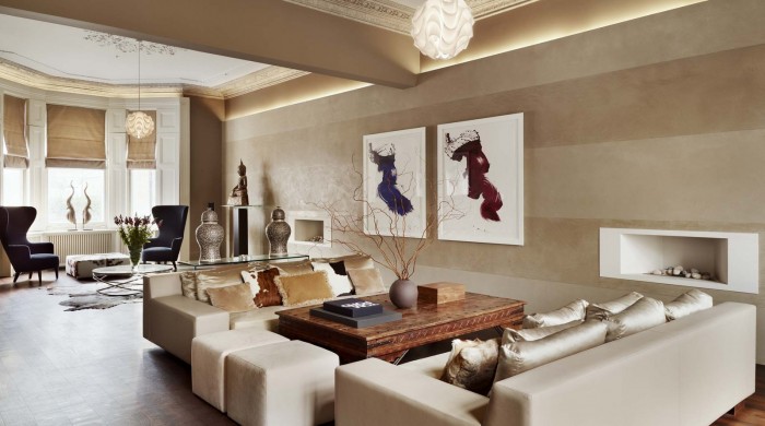 A living room with beige walls and white furniture that exudes refined luxury.