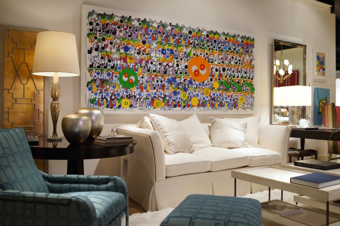 A living room featuring abstract art on the wall.