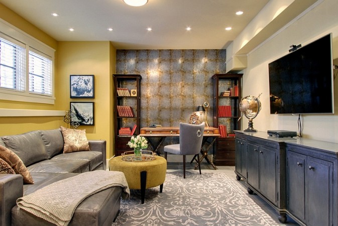 A living room with yellow walls and a gray couch, showcasing creative uses for the basement.