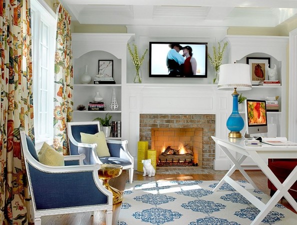 A spring-themed interior featuring a living room with a fireplace and a blue and white rug.