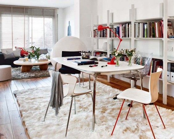 The Mid-Century Modern Home Office featuring a white rug and bookshelves.