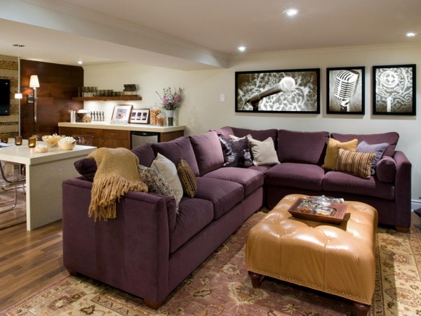 A living room with a purple couch and coffee table showcasing creative uses for the basement.