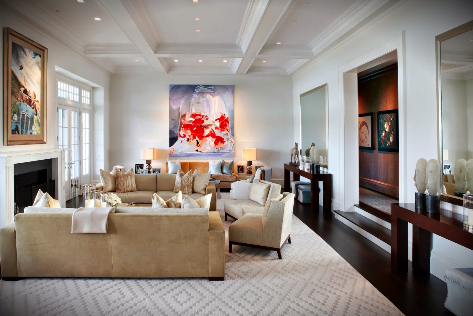 A living room with a large painting on the wall exudes refined luxury.