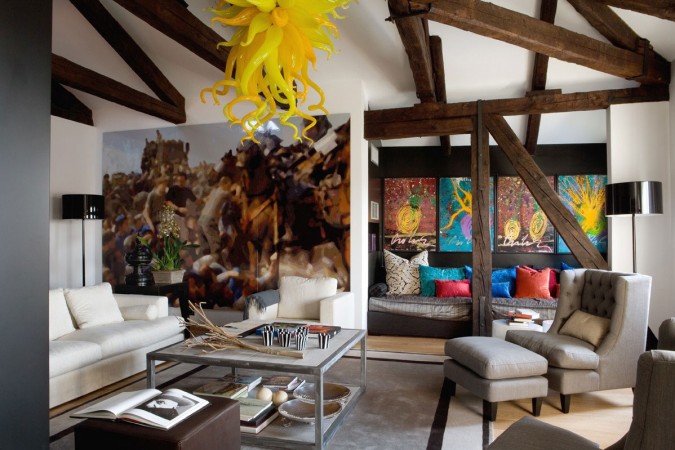 A living room showcasing a large abstract painting.