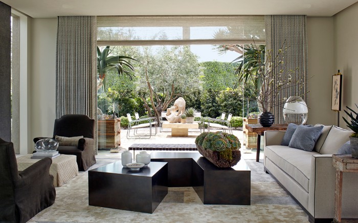 A living room with a large window that exudes refined luxury.