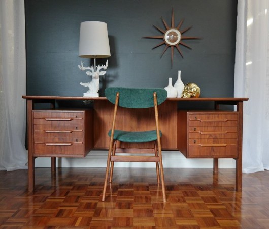 A Mid-Century Modern Home Office featuring a danish desk and green chair.