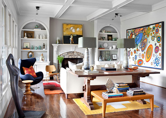A living room adorned with abstract art on the wall.