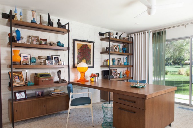 A home office with a desk and bookshelves, designed in Mid-Century Modern style.