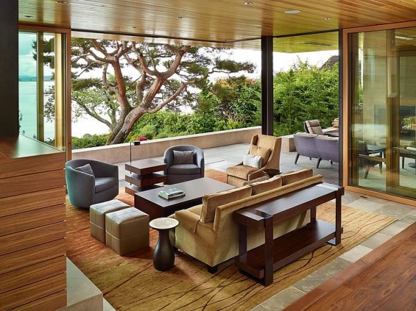 A living room with sculptural elements and a view of the ocean.