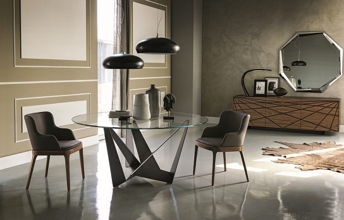 A modern dining room with sculptural chairs.