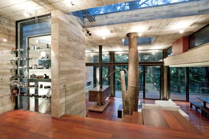 A modern treehouse with wooden floor and walls.