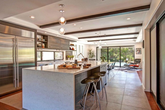Open kitchen with waterfall countertops