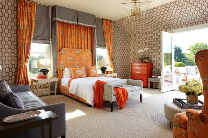A Designer Showhouse bedroom with a bed and chairs.