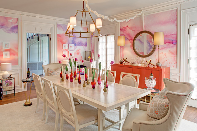 A pink and white dining room with a white table and chairs showcased in a Designer Showhouse.