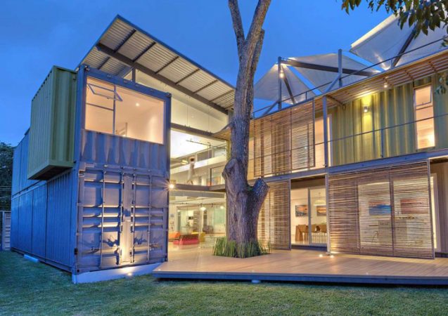 Creative Container House with a Tree in the Yard.