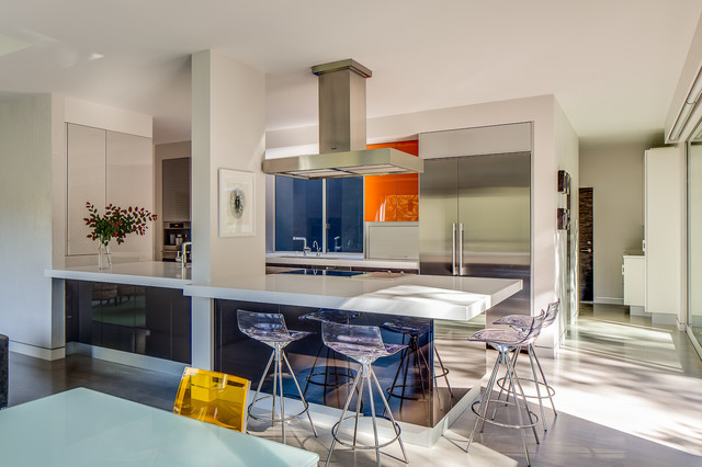 A modern kitchen with vibrant colors and character.